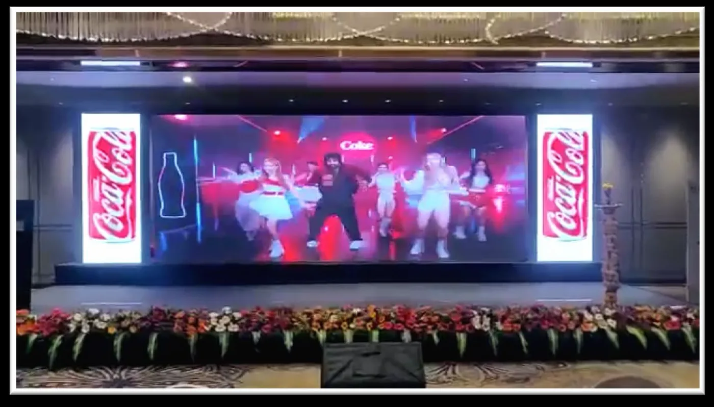 LED video wall at a Coca-Cola event stage set up by Shristi Advertising