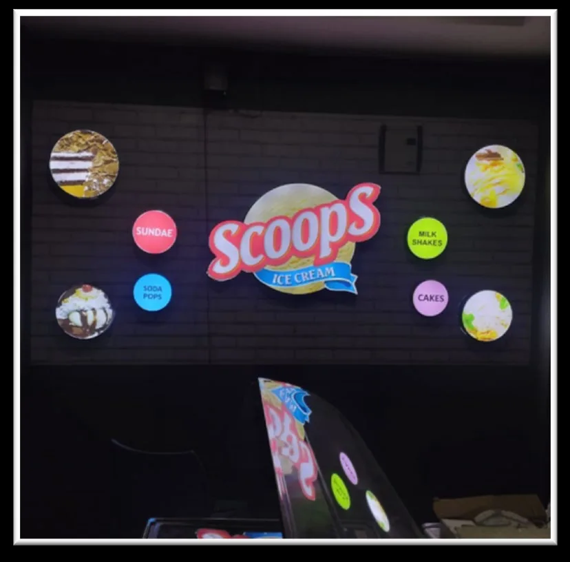 Scoops Ice Cream illuminated LED sign at night in Tirupati